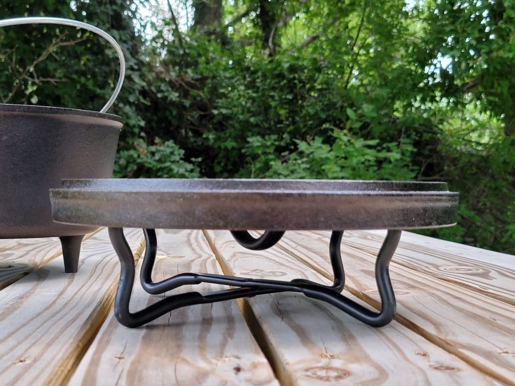 Inverted dutch oven lid on a stand