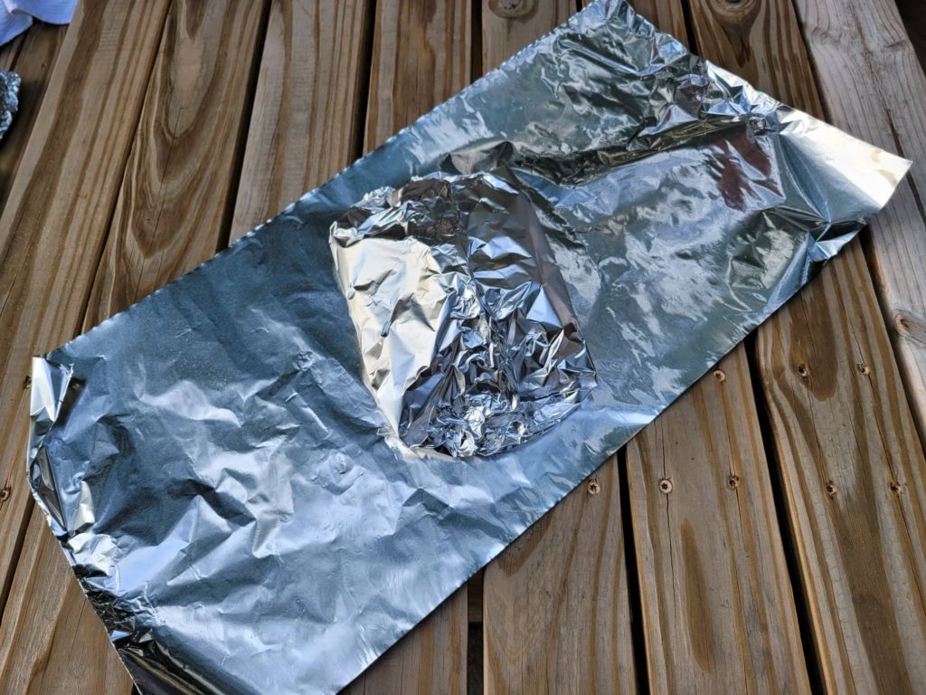 folding aluminum foil into cooking packets 