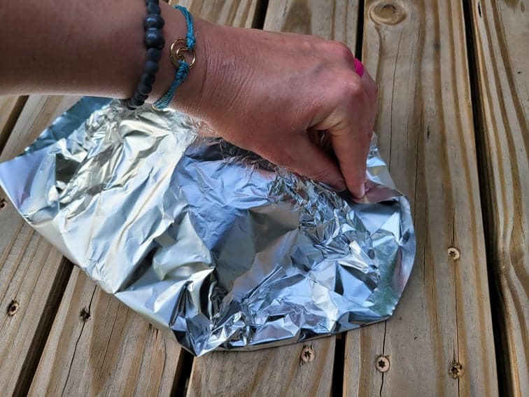 folding aluminum foil into cooking packets 