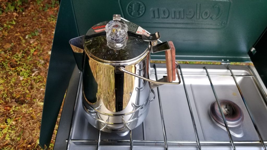 assembled camping percolator pot on a camping stove ready to make paleo mulled apple cider