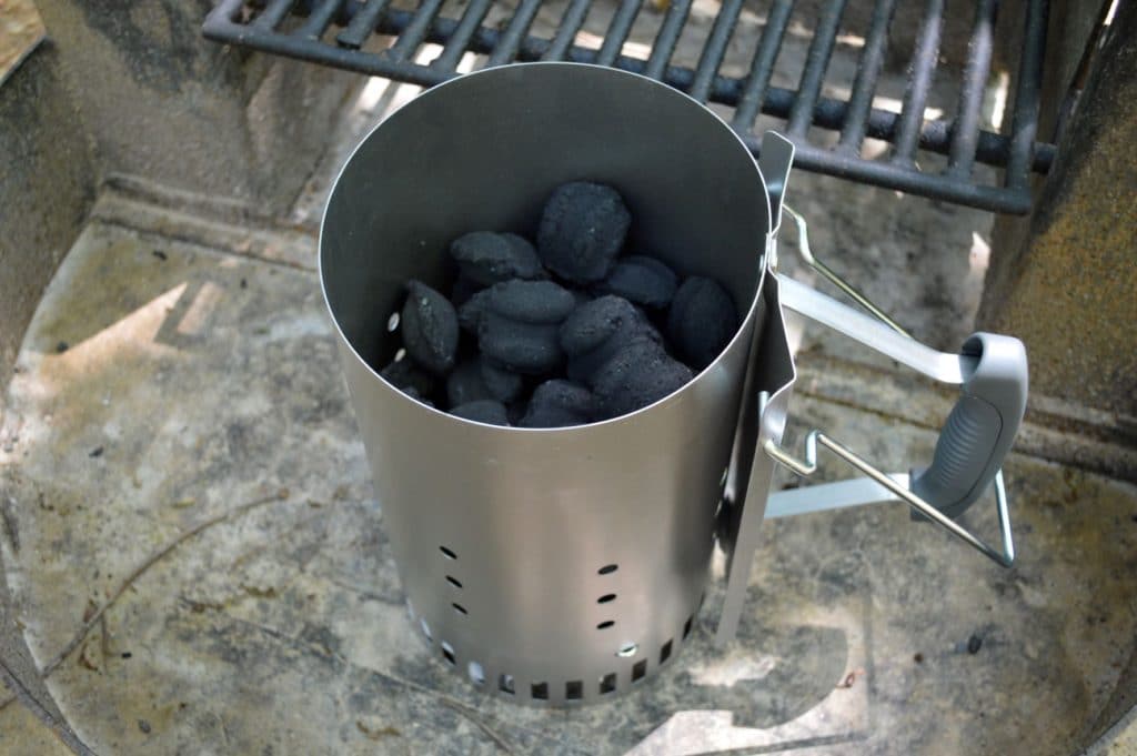 charcoal briquettes in the chimney starter before lighting it