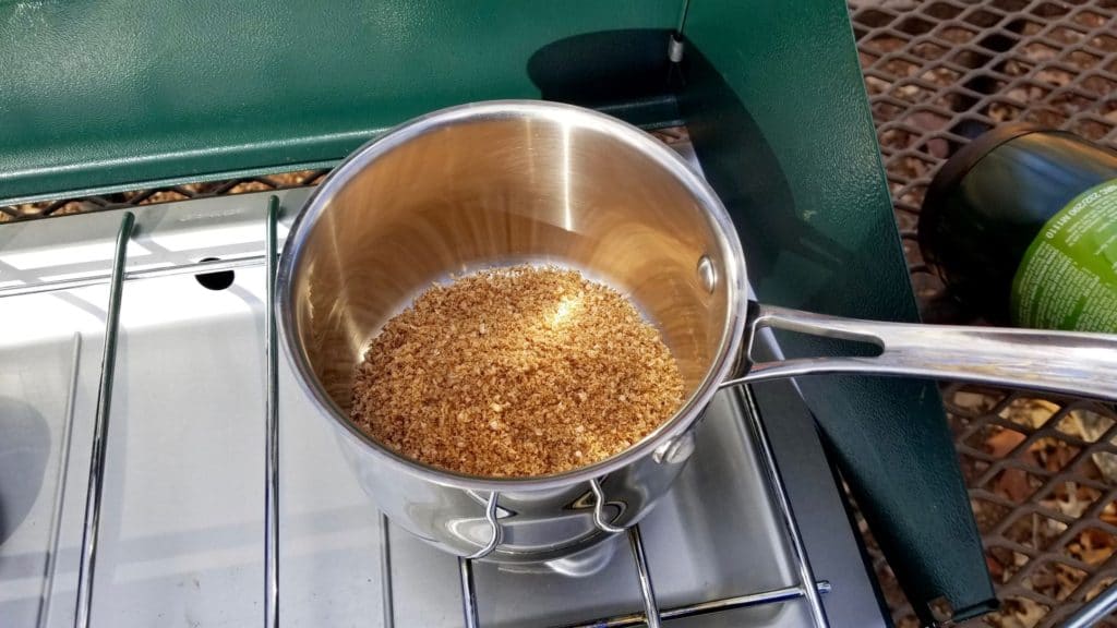 dry paleo instant oatmeal ingredients in a saucepan on a camping stove