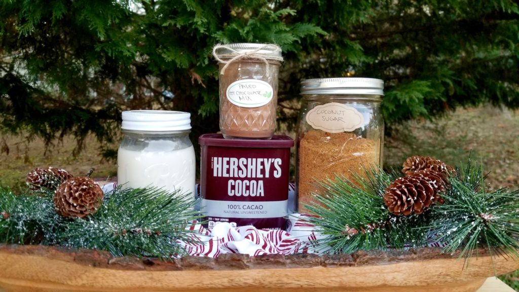 glass mason jars containing ingredients for paleo hot chocolate mix