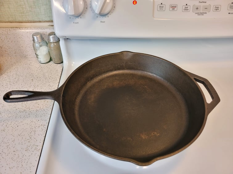 Evaporating residual moisture by heating the skillet on a stovetop  burner