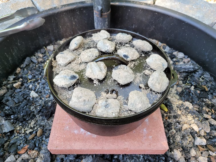 Dutch oven with hot charcoal on lid