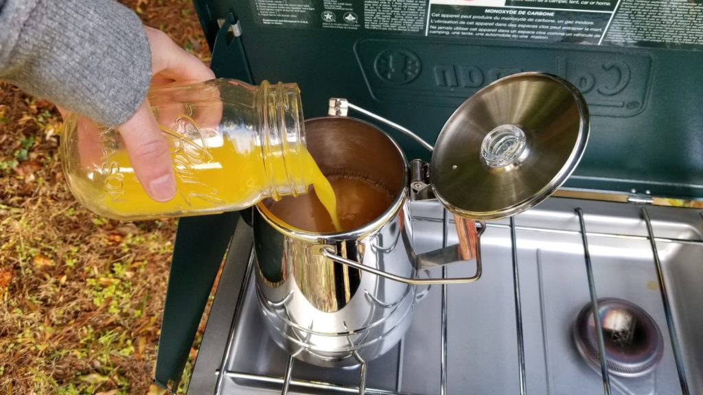 adding orange juice to the percolator pot 