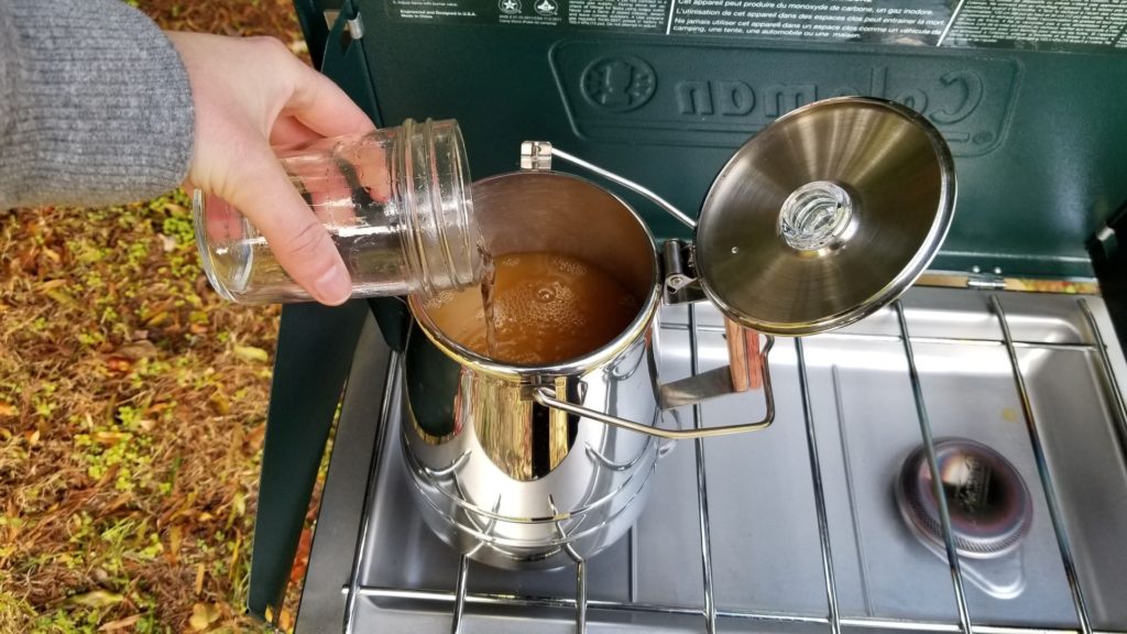 adding water to the percolator pot