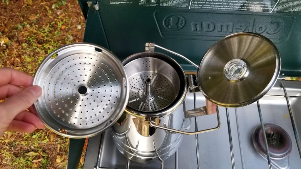 removing the strainer lid from a camping percolator pot 