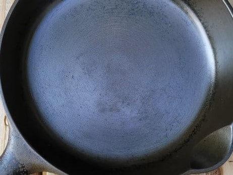 An old skillet with a factory-smoothed surface