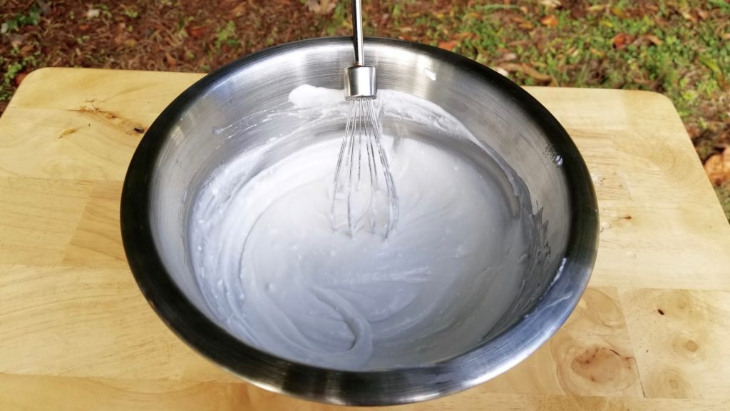whipped coconut cream in a mixing bowl 