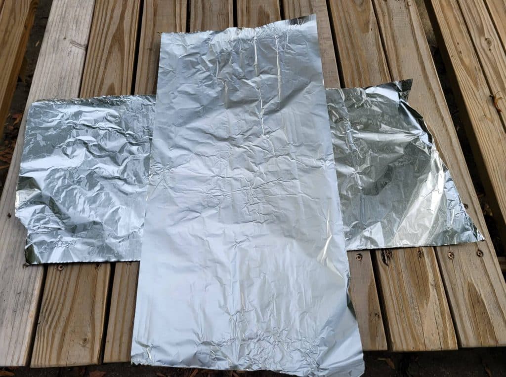 two pieces of foil prepared for foil packet ingredients 