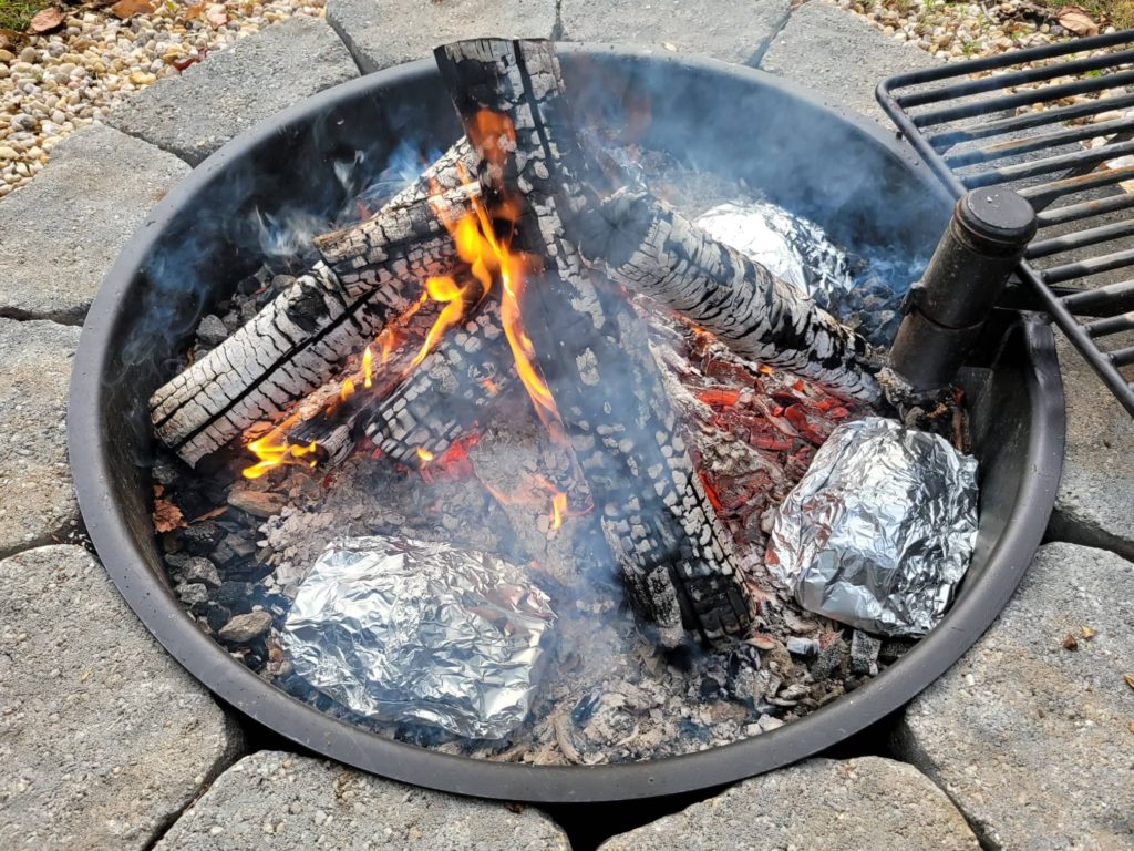 cooking foil packets on campfire