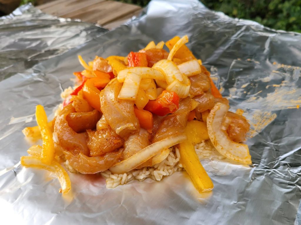 Fajita chicken, veggies, and rice on foil 