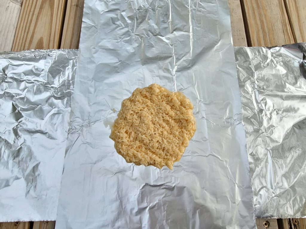 Seasoned rice on aluminum foil sheet