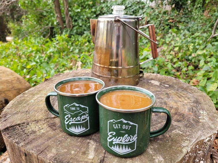 https://campfiresandcastiron.com/wp-content/uploads/2021/12/Green-Coffee-Mugs-In-Front-Of-Large-Percolator.jpg