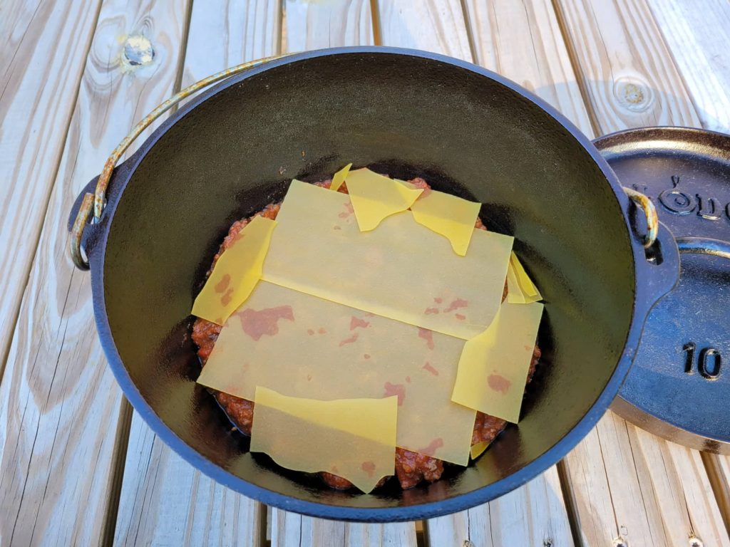 layered lasagna noodles in dutch oven
