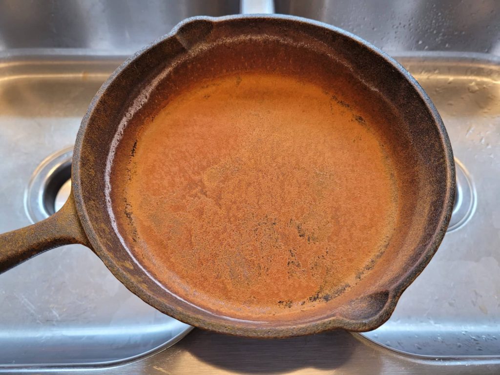 cast iron skillet with surface rust