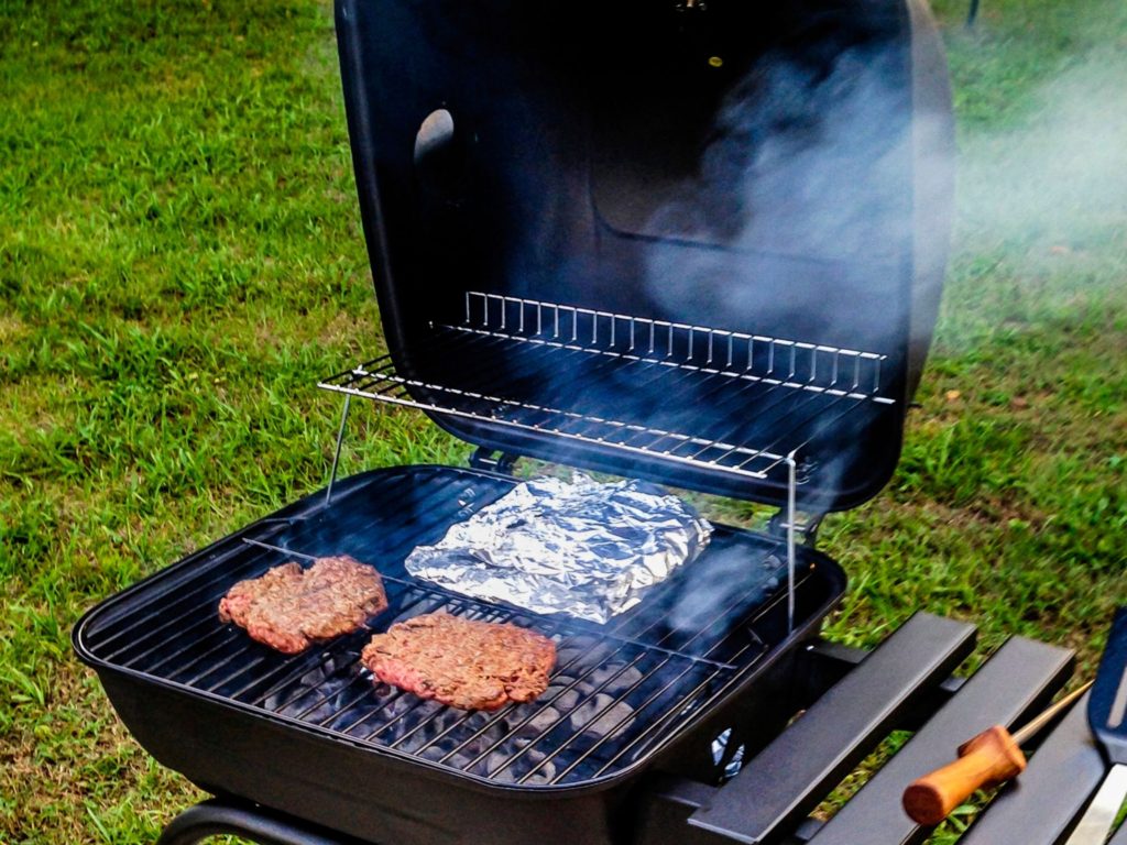 Foil packet cooking on a charcoal grill