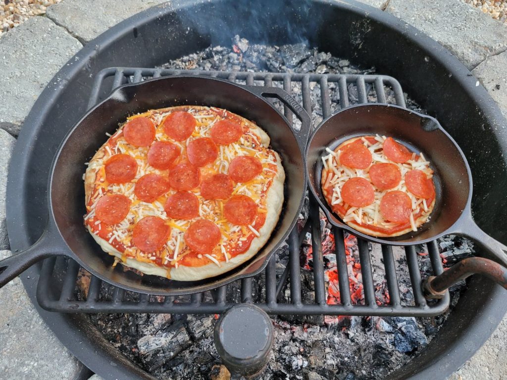 Cooked campfire skillet pizzas 