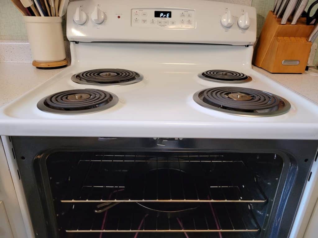 cast iron pan preheating in an oven 