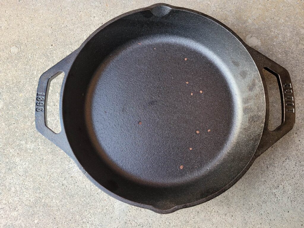 pre-seasoned cast iron pan with rust spots
