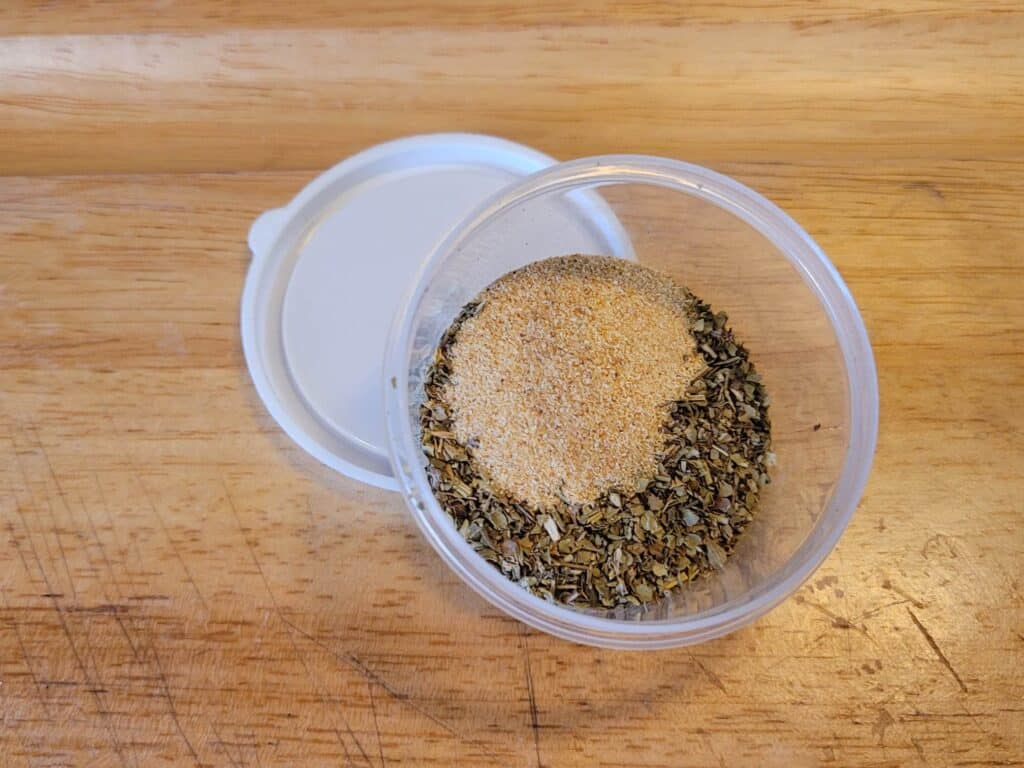 Cooking spices in a small plastic container