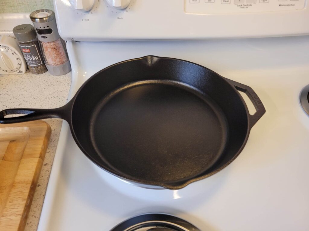 storing a clean cast iron skillet on a the stovetop