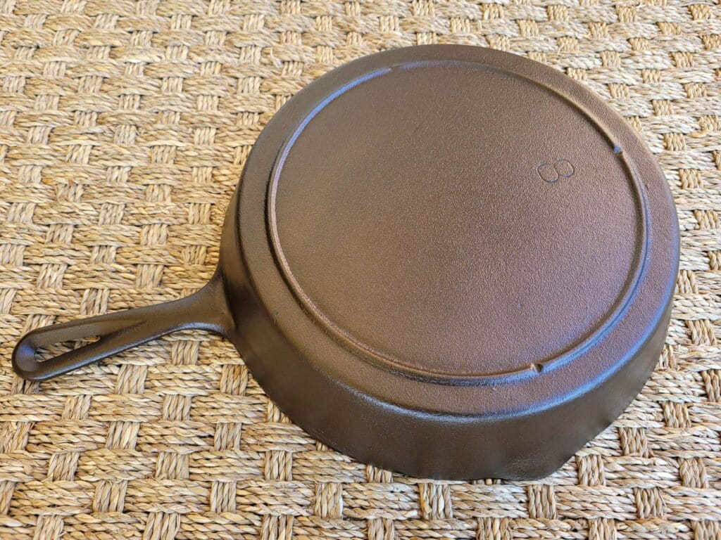 Newly restored, bronze-colored cast iron skillet