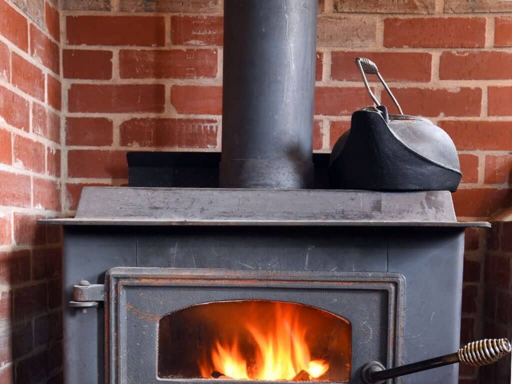 Cast iron kettle on wood stove as a humidifier 