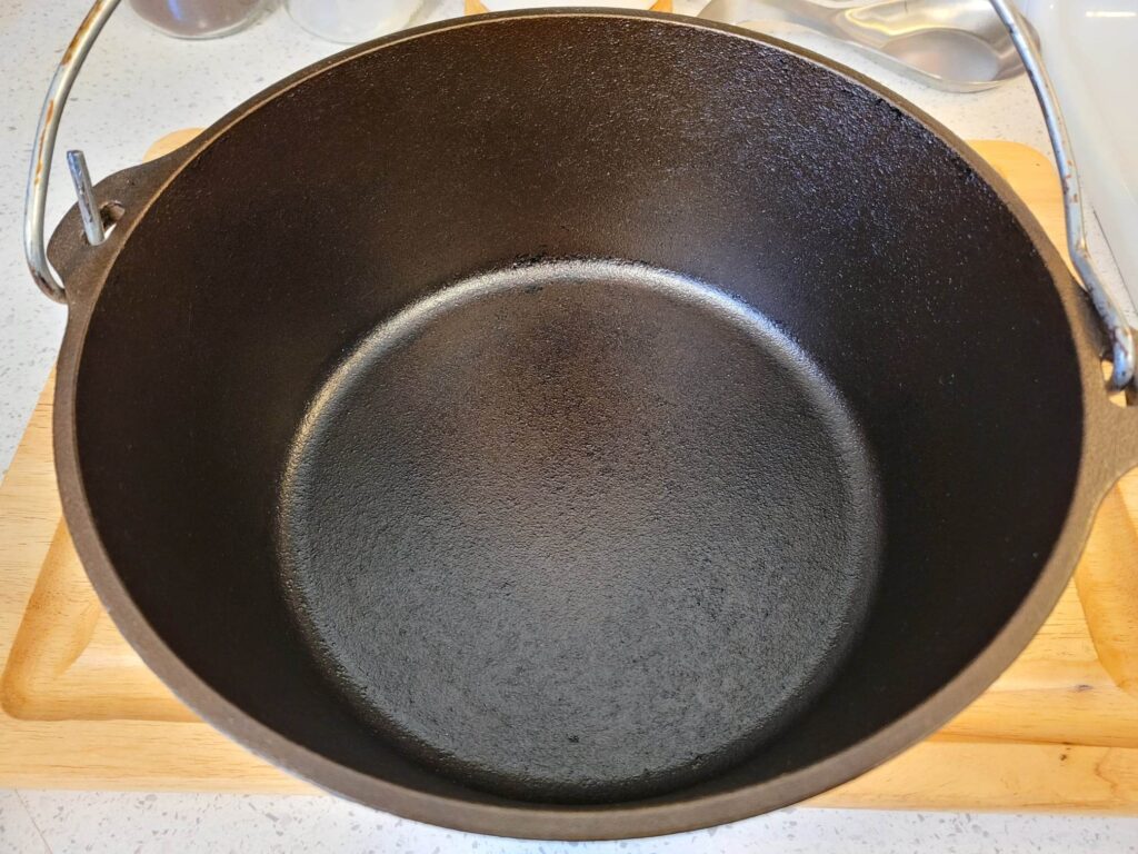 Dutch oven prior to boiling water with seasoning intact. 